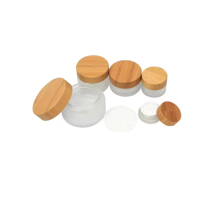 Wholesale Cosmetics Water Emulsion Essence Face Cream Spray Facial Cleanser Glass Bottle Sunscreen Container With Wooden Cover